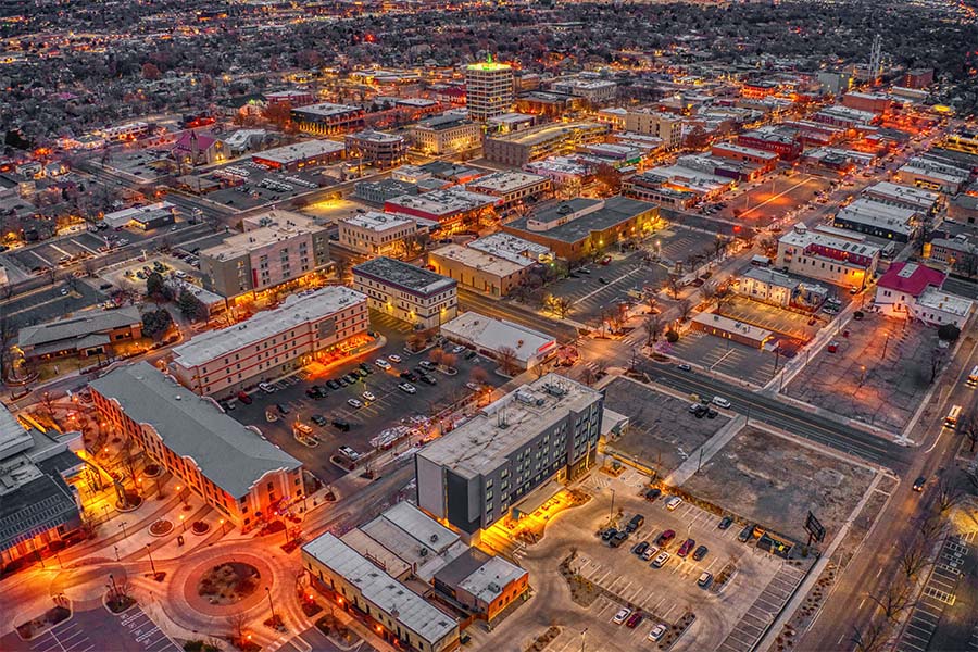 Grand Junction, CO - Aerial View of Buildings with Colorful Lights in Downtown Grand Junction Colorado in the Evening During the Winter Season